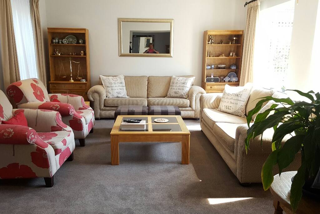 Living room doors open into secure and private courtyard