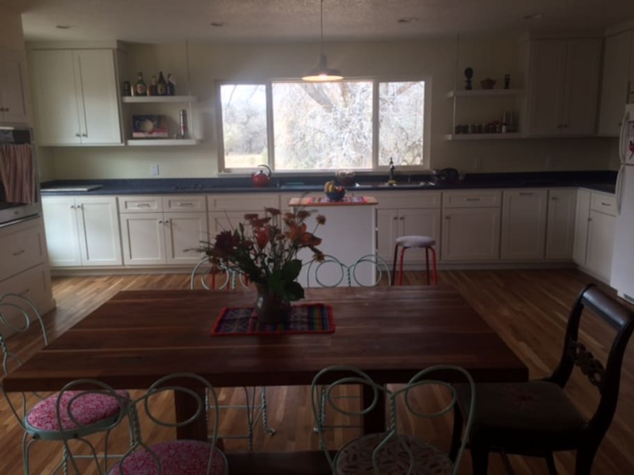 Spacious kitchen and open dining area during mid-day
