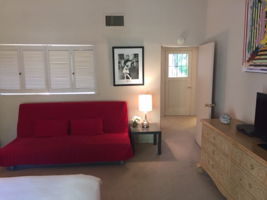 Bedroom facing door to roof-deck