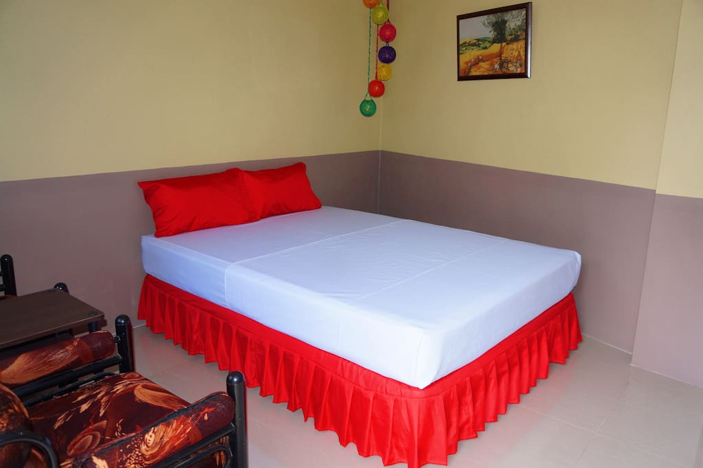 Room 7 - Superior Room with queen size bed, Aircon, TV, couch, toiletries and Comfort room with shower.