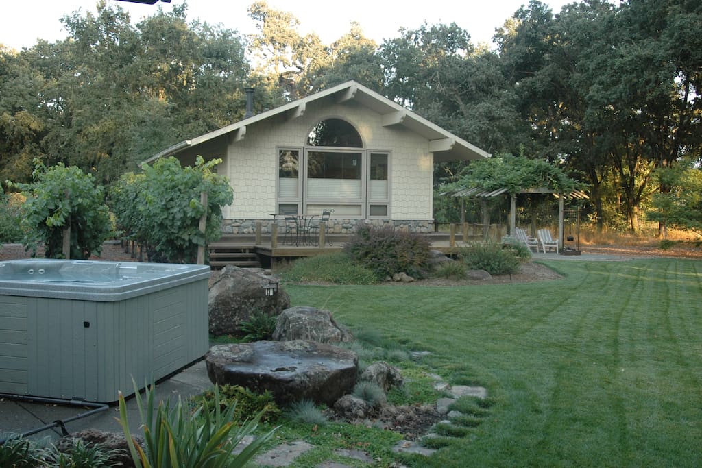 Acorn Cottage features a private hot tub and patio.