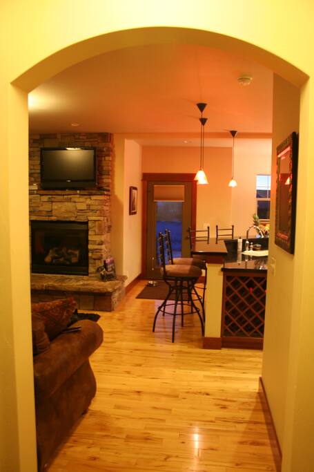 Entry hallway showing parts of LR, Kitchen, DR & rear exit