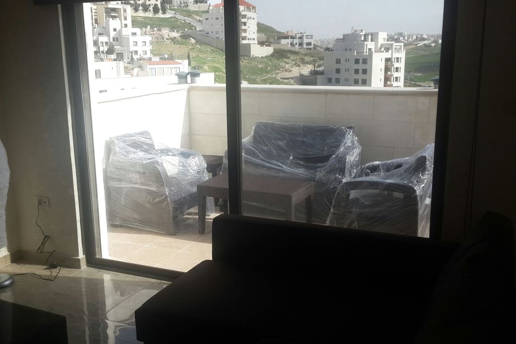 The living room window over looking to the terrace & Dear Ghebar & Abdoun area