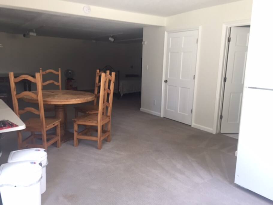 Private dining table in suite with refrig, freezer, microwave.