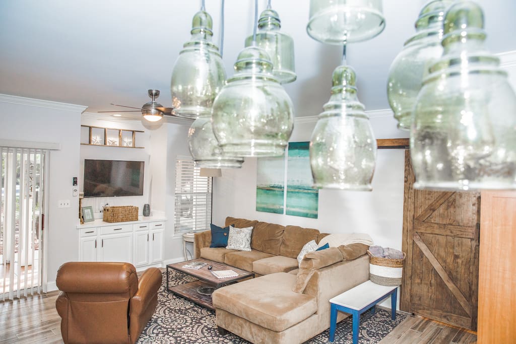 Beautiful blown glass pendant chandelier overlooking the living room