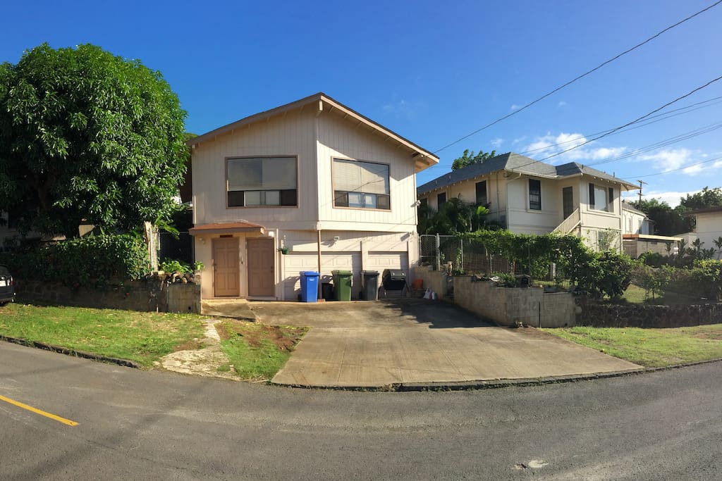 House exterior. Guest room is on the upslope side (facing mango tree)