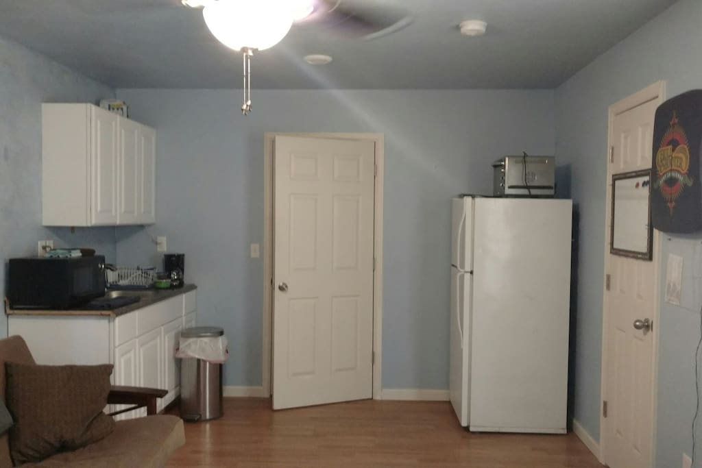kitchenette: microwave, small coffee pot, microwave, and toaster oven
kitchen table and chair