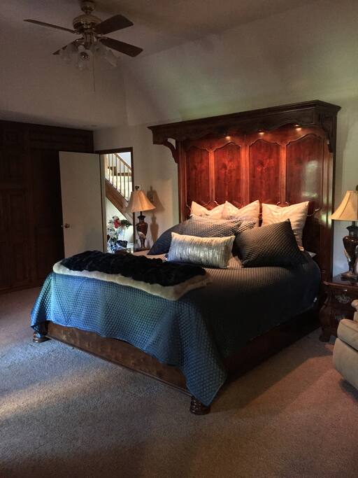 Master Bedroom with fireplace and big screen tv.