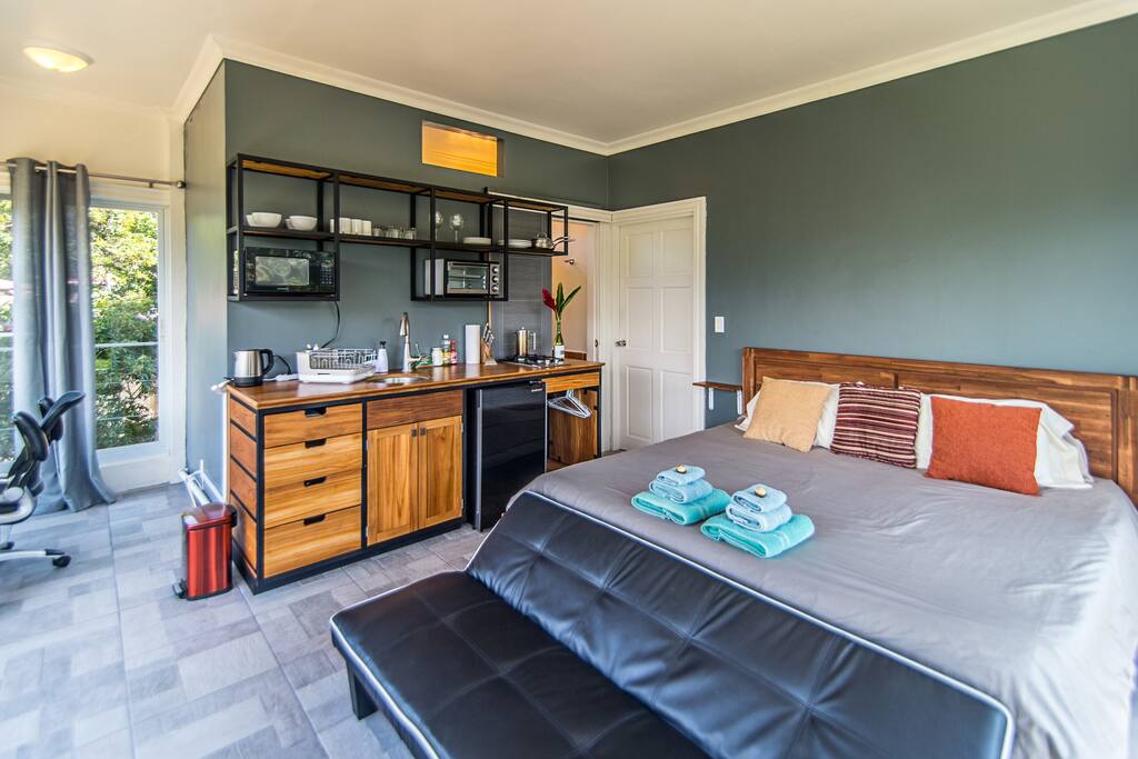 The room comes fully equipped with a kitchen