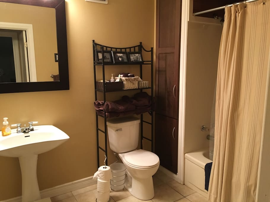 Spacious washroom with fresh towels, face cloths, hair dryer, and well-stocked with toiletries