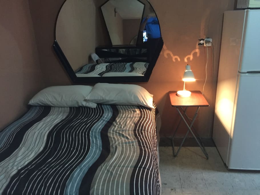 Full bed with light stand