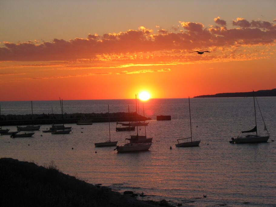 Little Traverse Bay sunset viewed from the front porch of this Bay View (Petoskey) MI cottage