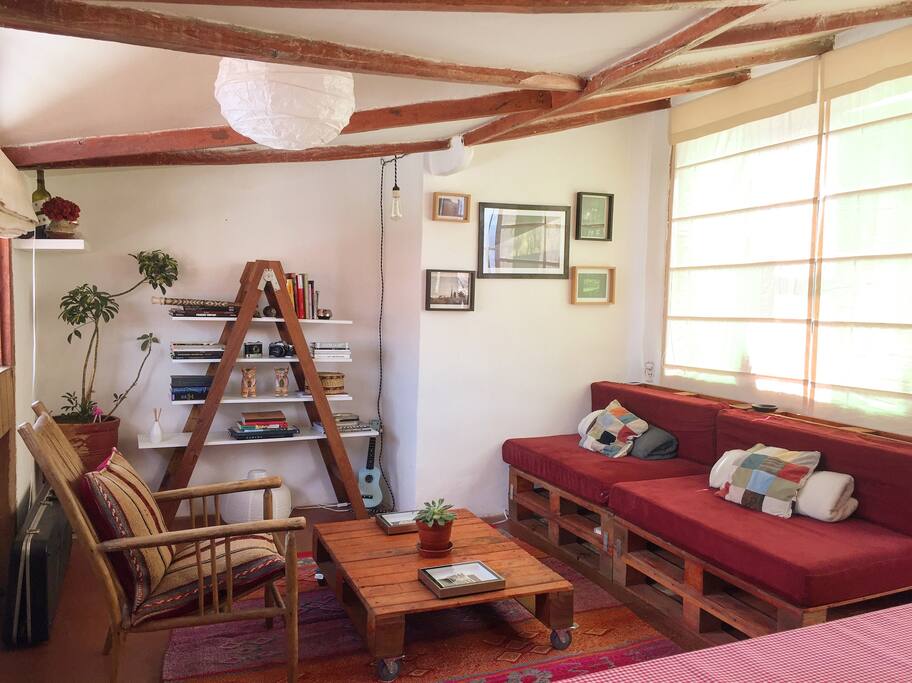 The living room, cozy, warm and with a nice view. You can read, watch a movie, or have a drink here. Make this house your place!