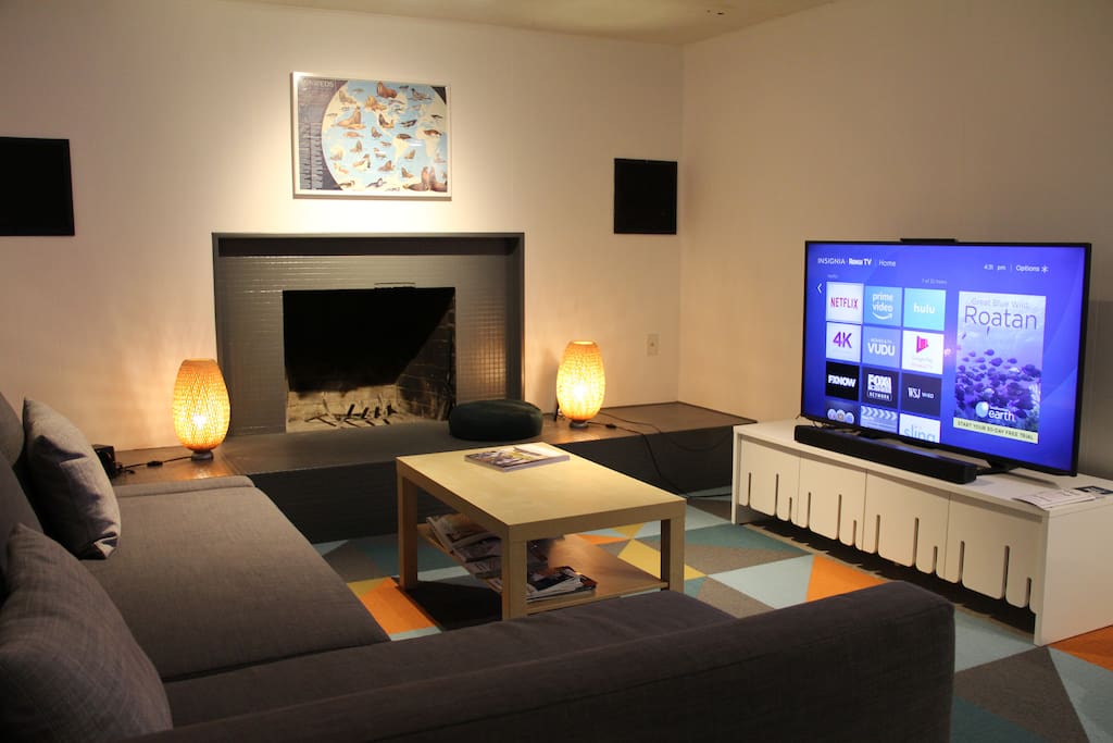 Living room with fireplace. TV is a 55" ultra HD (4K). No cable TV, but there's free Netflix, Amazon Prime, Blu Ray player, Wii game console, and an HDMI cable so you can plug your laptop into the TV.