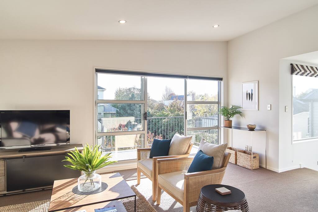 The sunny living area is upstairs