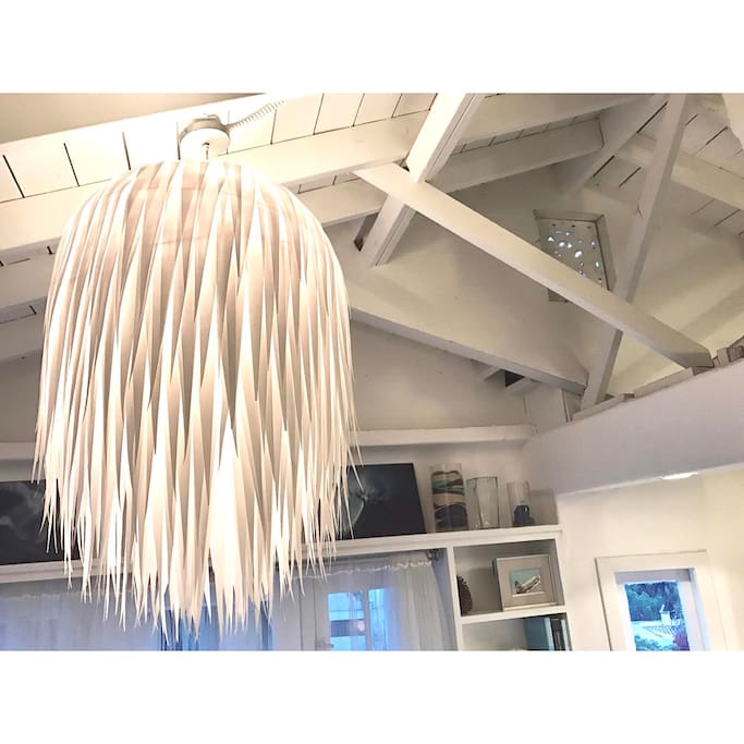 Fun fact: This beautiful paper chandelier in our living room was made by us! :) and is available for purchase