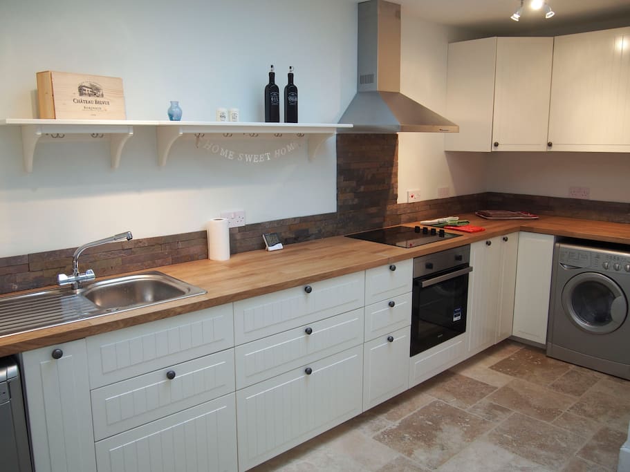 Open plan kitchen with dishwasher and usual stuff