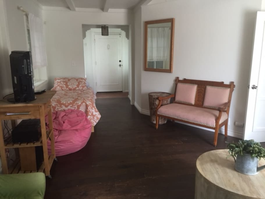 Living room with twin bed - looking at your front door.