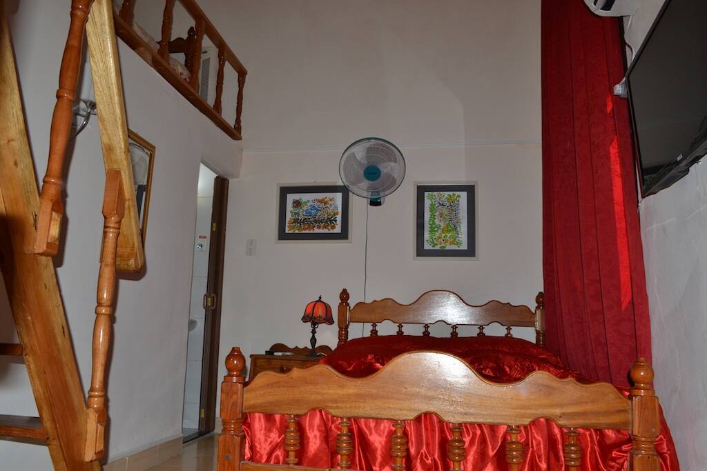 Room with individual bathroom and extra bed on a mezzanine