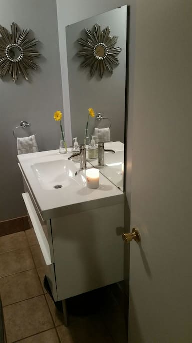 Bathroom with stand up shower, no bathtub.