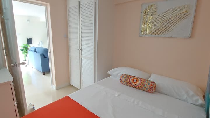 Each bedroom has an AC unit and comprises a double bed. Bedroom 2 has an ironing board, iron and blow dryer in the closet.