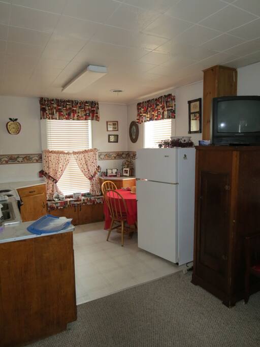 This Is the kitchenette that is attached to Americana room. It has ever thing you would need to cook and eat with. It has a refrigerator, stove, microwave, and coffee make.