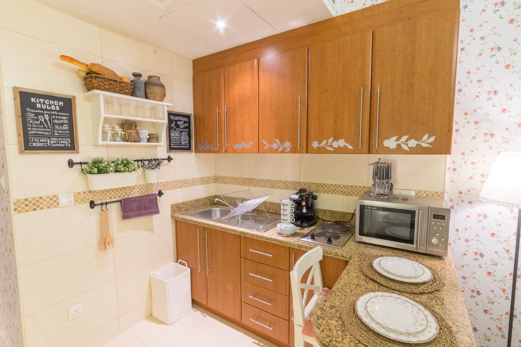 Fully Equipped Kitchen Including Microwave, Coffee Machine, full-set of cutleries.