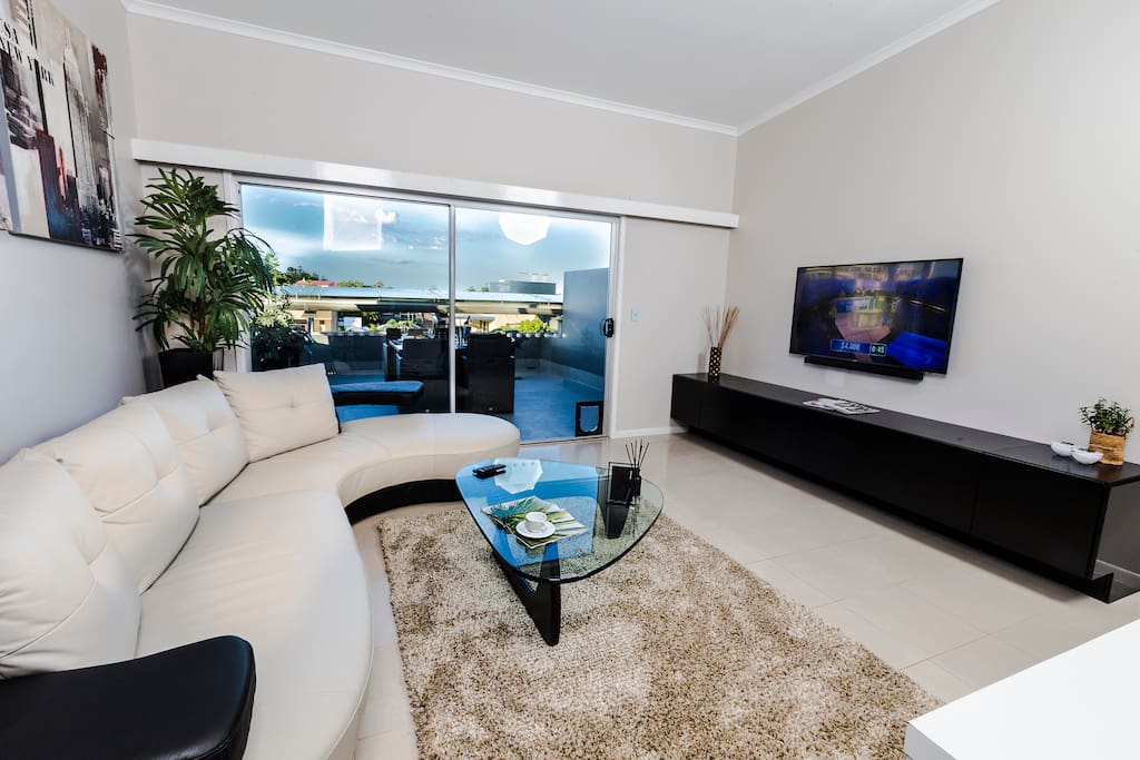 Lounge/ Smart TV with sound bar.