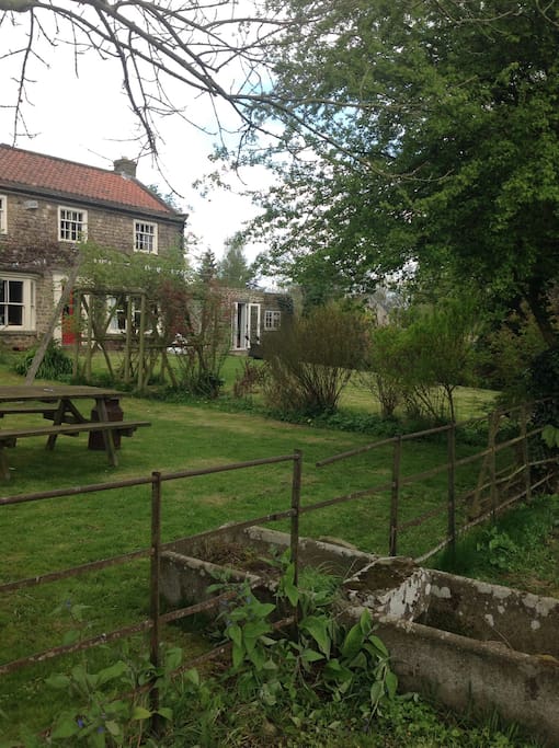 The Den is a separate dwelling to the right in this photo. Guests are welcome to enjoy the garden overlooking open countryside.