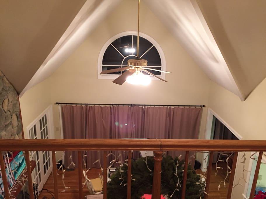 View of the great room from balcony. Note the cathedral ceiling.