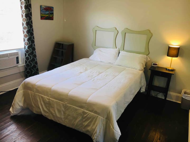 Guest bedroom with comfortable bed and fresh linens. Enjoy the original 1920’s wood floors. 