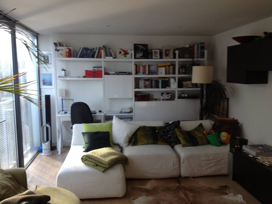 Living room with a very comfy sofa and large windows