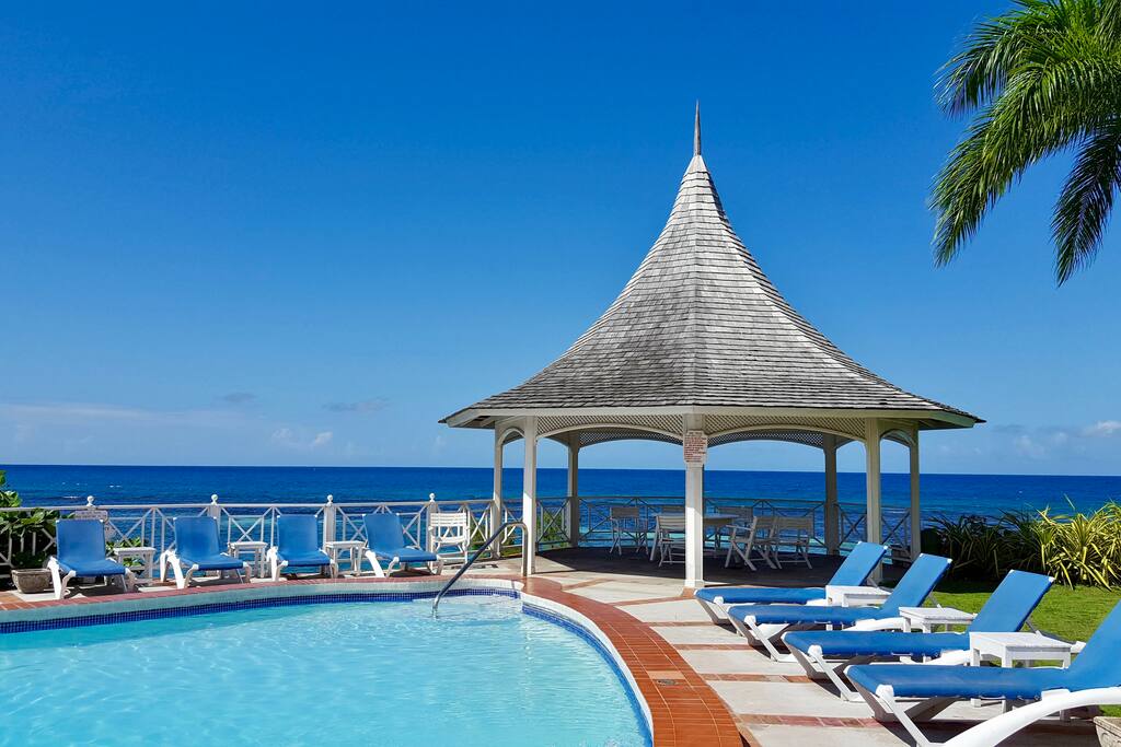 The pool deck with comfortable gazeebo when you need some shade