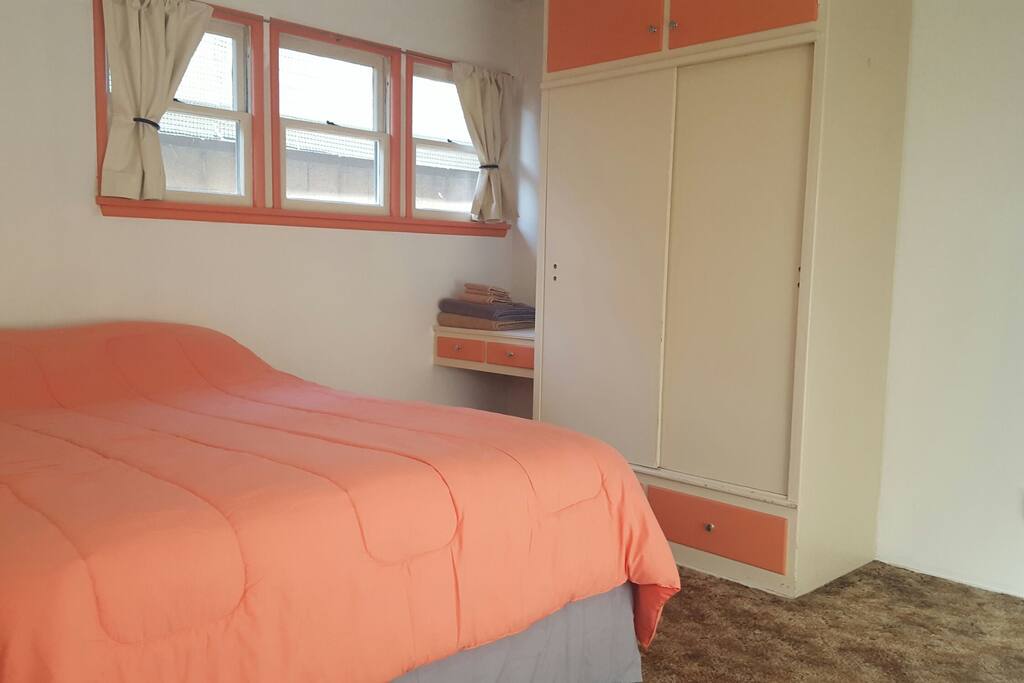 Bed, wardrobe, and vanity