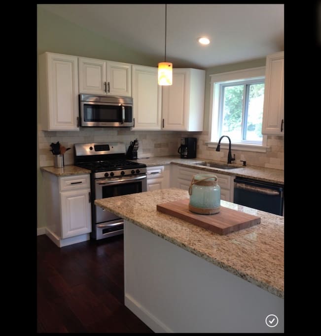 Fully stocked kitchen with breakfast bar