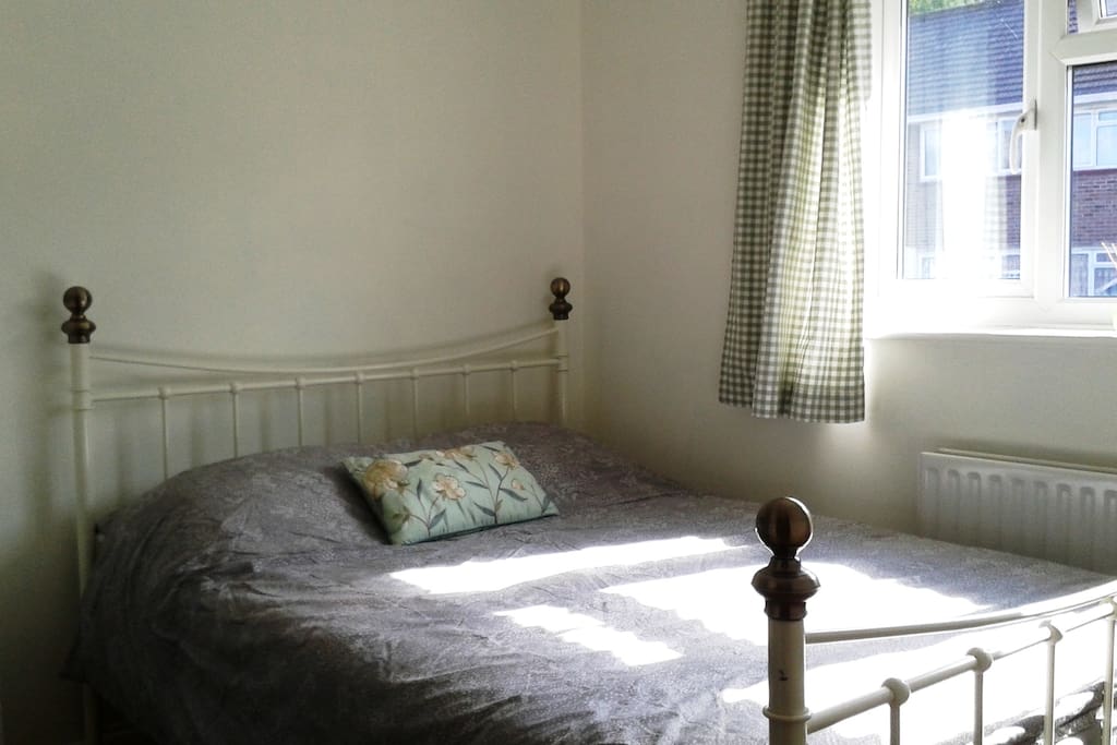Comfortable bed in sunny, south-west facing room