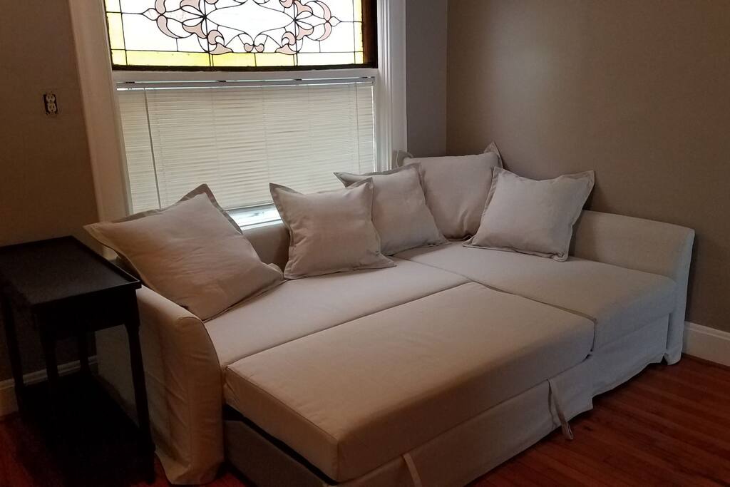 Sectional sofa converts to queen-sized bed.