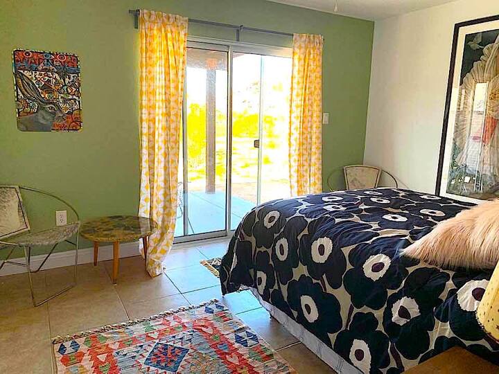 Bedroom Number Three: This bedroom has a Queen Size Bed and faces north. The sliding glass door opens up to a private porch with an overhang to protect you from the weather. It is the smallest of the three rooms but a favorite because of it's views, 