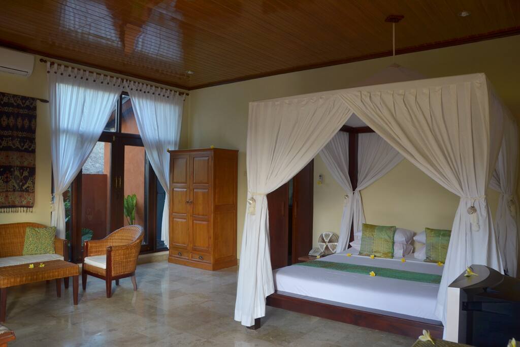 Spacious 5m x 6m bedroom / living room with marble floor.