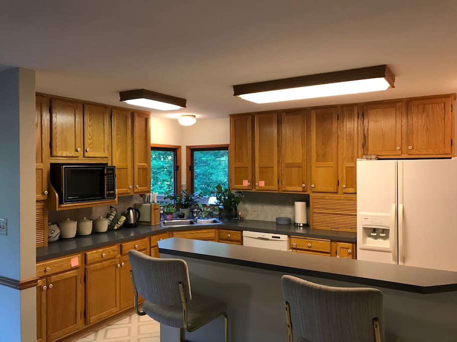 Kitchen with gas stove and breakfast bar