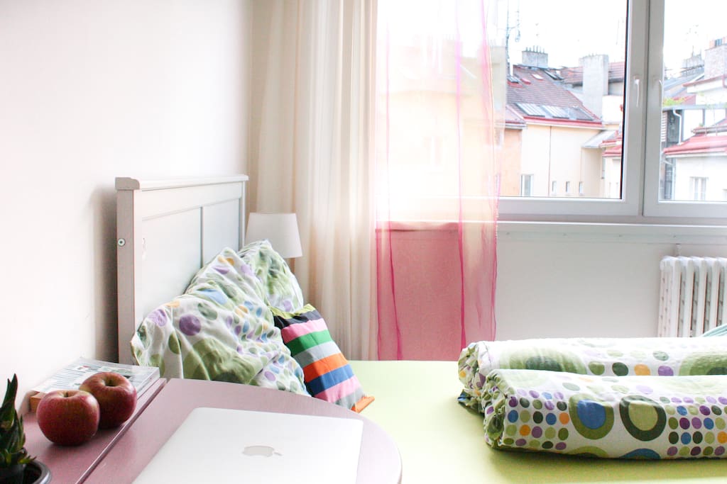Wake up to the melting view of Prague's rooftops.