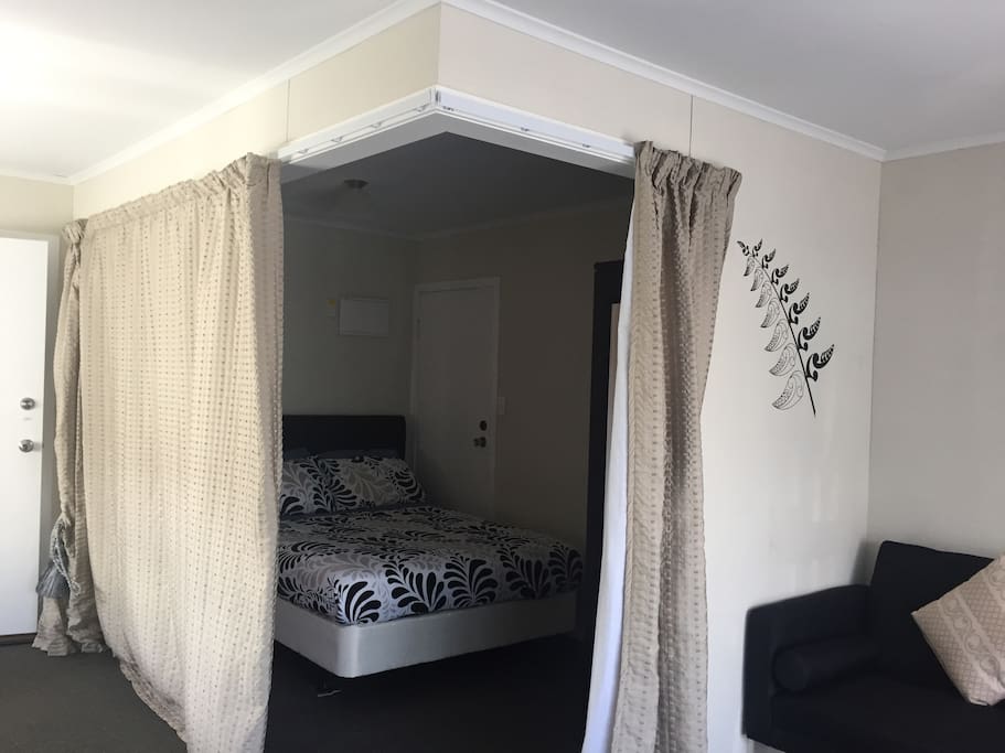 Bedroom with pull around thermal privacy curtains