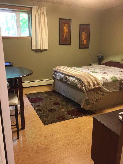 First bedroom on first floor of house with queen size bed for two