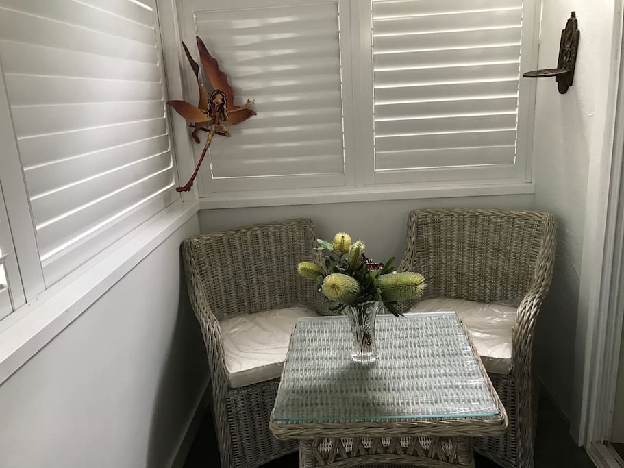 verandah has small table and chairs