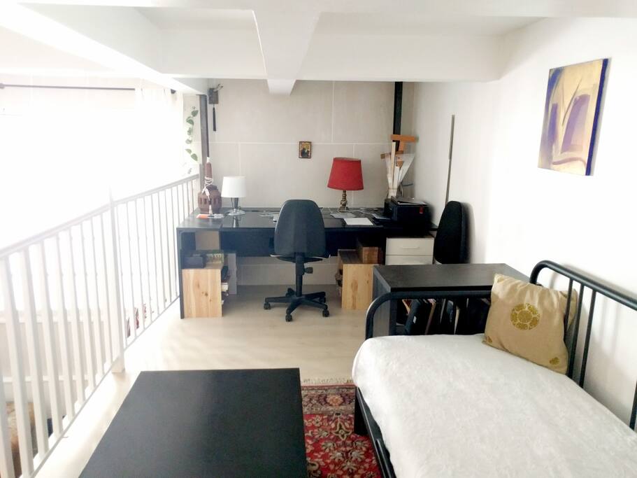 The desk offers plenty of room for writers and designers to work.
