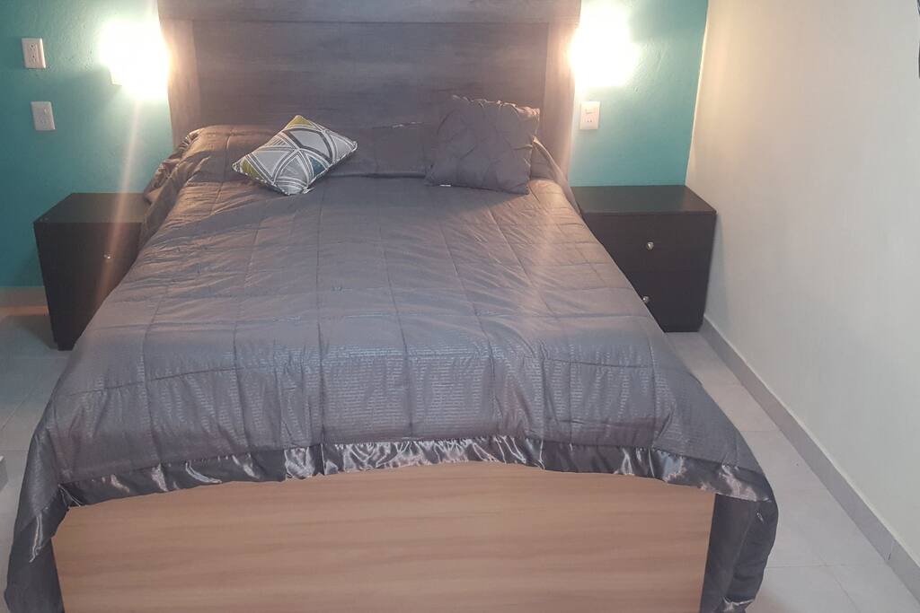 Double bed with a pair of lights to read