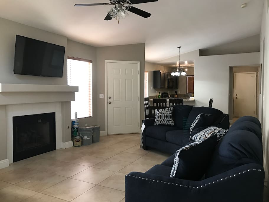 Main living area connecting to dining & kitchen area