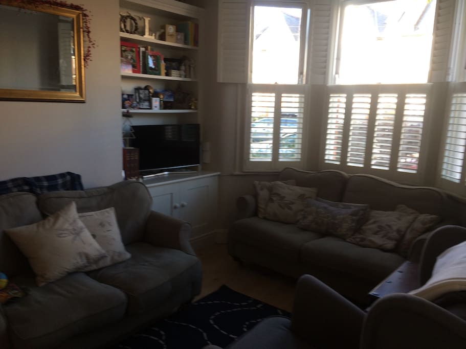 Cosy living room with two 2seater sofas, armchair and tv/internet access.