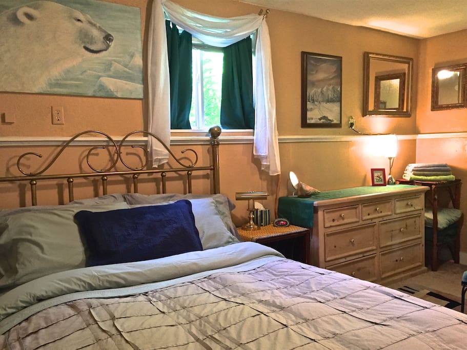The "oh so comfortable" queen size bed with egyptian Cotton linens and Blackout curtains for "The Midnight Sun".