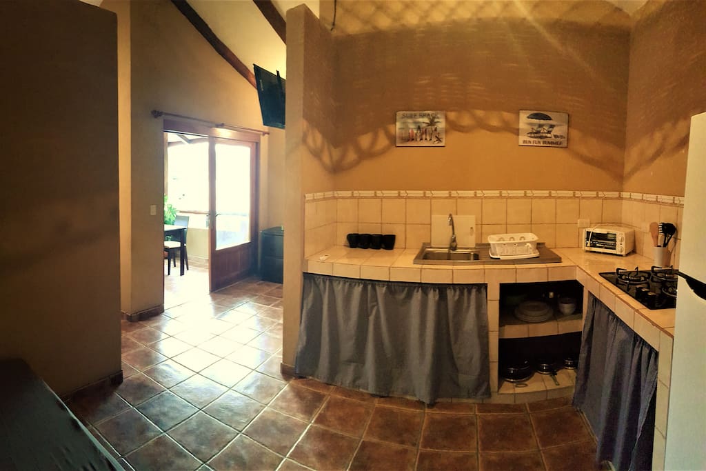 Fully equipped kitchen and the view to your balcony